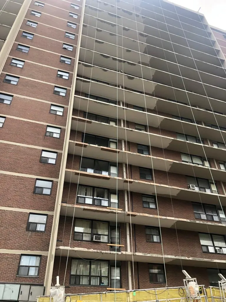 Balcony restoration under way on a Toronto brick high-rise