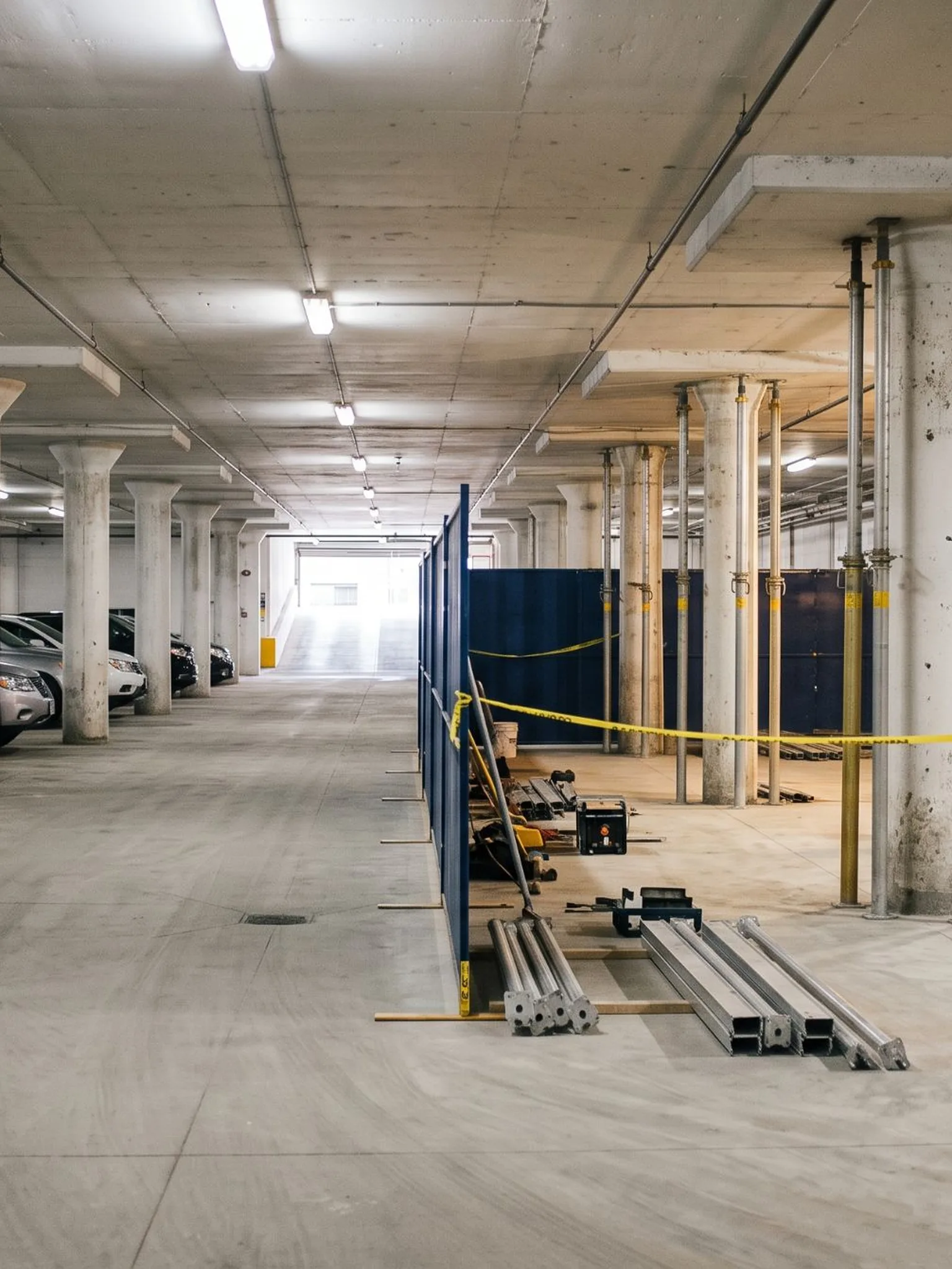 Shored columns and hoarding during rehabilitation of a large underground condominium parking garage